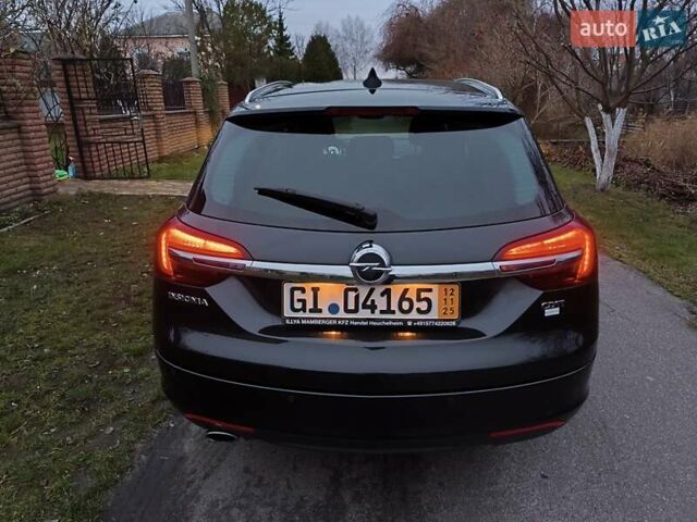 Черный Опель Инсигния, объемом двигателя 1.96 л и пробегом 255 тыс. км за 10999 $, фото 6 на Automoto.ua