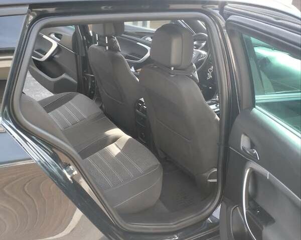 Чорний Опель Інсігнія, об'ємом двигуна 1.6 л та пробігом 225 тис. км за 12200 $, фото 1 на Automoto.ua