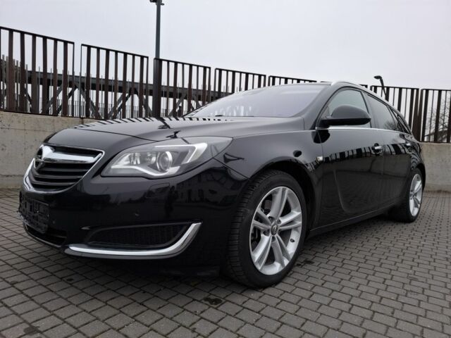 Чорний Опель Інсігнія, об'ємом двигуна 2 л та пробігом 234 тис. км за 12940 $, фото 1 на Automoto.ua