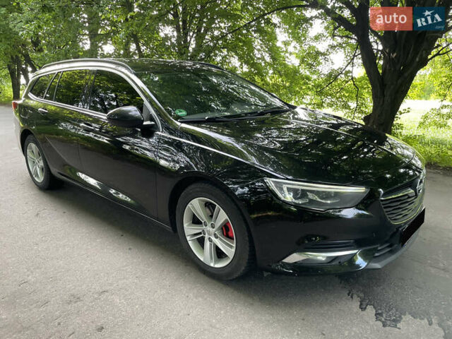 Черный Опель Инсигния, объемом двигателя 2 л и пробегом 235 тыс. км за 13950 $, фото 4 на Automoto.ua