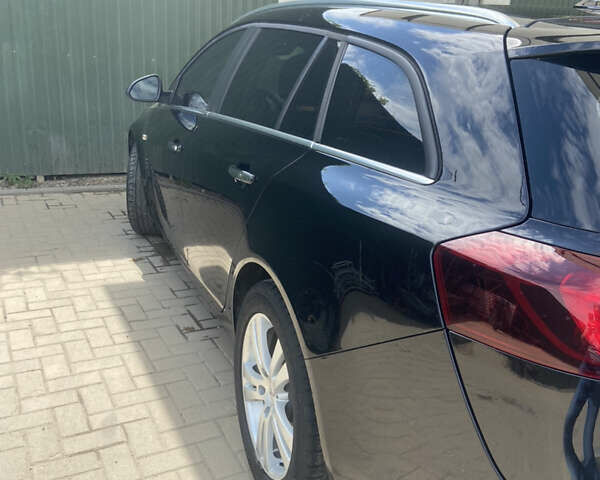 Чорний Опель Інсігнія, об'ємом двигуна 2 л та пробігом 197 тис. км за 10900 $, фото 4 на Automoto.ua