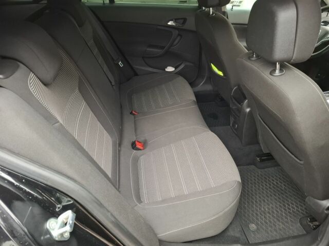 Чорний Опель Інсігнія, об'ємом двигуна 2 л та пробігом 234 тис. км за 12940 $, фото 13 на Automoto.ua