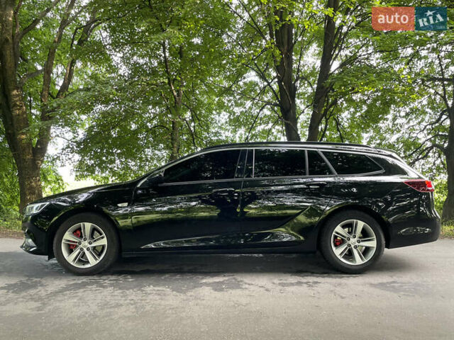 Черный Опель Инсигния, объемом двигателя 2 л и пробегом 235 тыс. км за 13950 $, фото 6 на Automoto.ua
