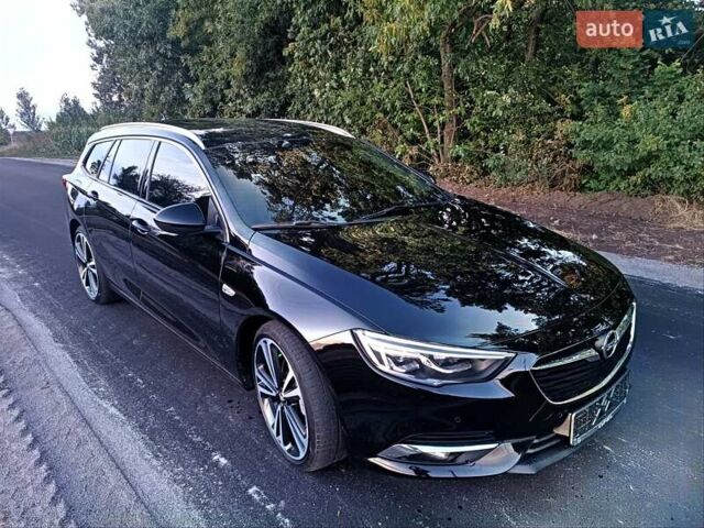 Чорний Опель Інсігнія, об'ємом двигуна 2 л та пробігом 215 тис. км за 16800 $, фото 1 на Automoto.ua