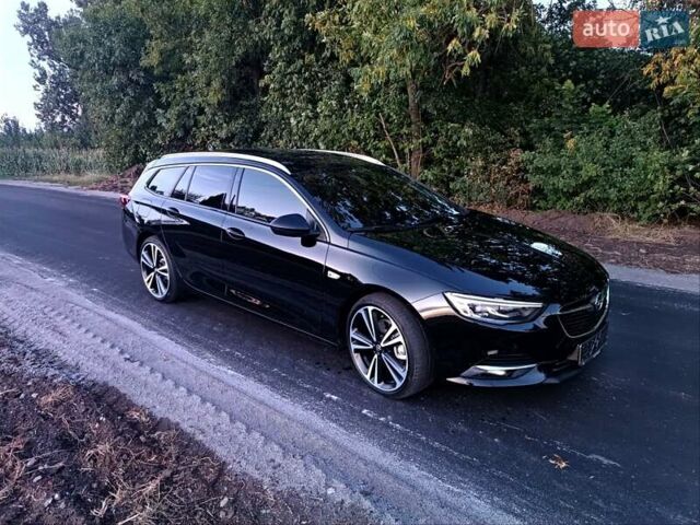 Чорний Опель Інсігнія, об'ємом двигуна 2 л та пробігом 215 тис. км за 16800 $, фото 2 на Automoto.ua
