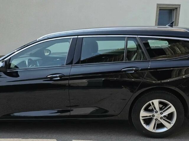 Черный Опель Инсигния, объемом двигателя 2 л и пробегом 25 тыс. км за 18400 $, фото 2 на Automoto.ua