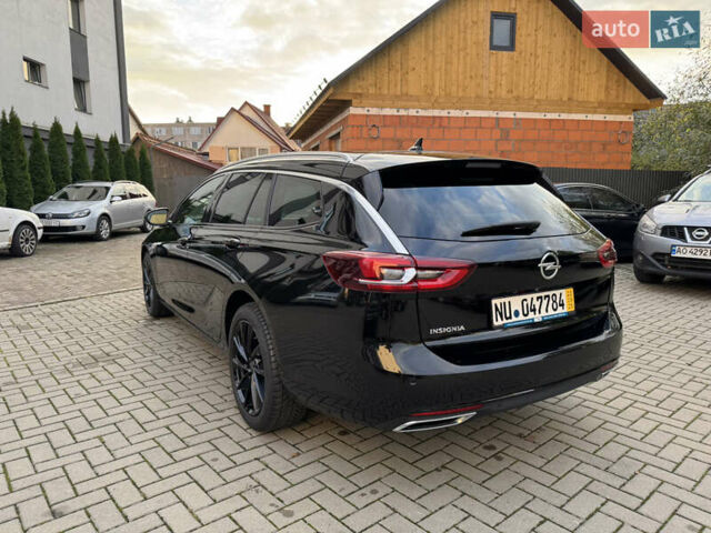 Чорний Опель Інсігнія, об'ємом двигуна 1.96 л та пробігом 213 тис. км за 18422 $, фото 7 на Automoto.ua