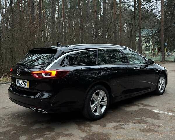 Черный Опель Инсигния, объемом двигателя 1.96 л и пробегом 168 тыс. км за 18800 $, фото 6 на Automoto.ua