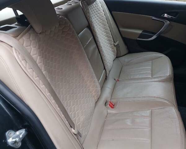 Черный Опель Инсигния, объемом двигателя 1.96 л и пробегом 380 тыс. км за 7500 $, фото 5 на Automoto.ua