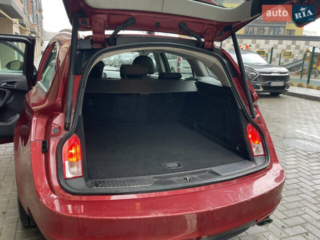 Червоний Опель Інсігнія, об'ємом двигуна 2 л та пробігом 210 тис. км за 6750 $, фото 54 на Automoto.ua