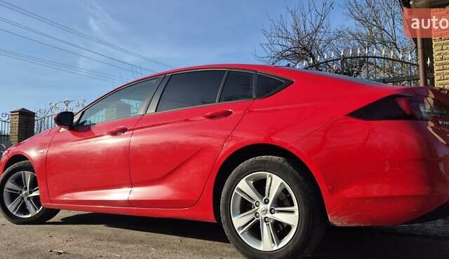 Красный Опель Инсигния, объемом двигателя 1.6 л и пробегом 130 тыс. км за 13999 $, фото 2 на Automoto.ua