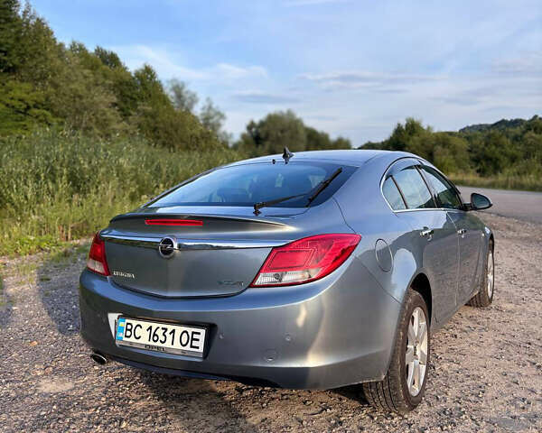Серый Опель Инсигния, объемом двигателя 1.96 л и пробегом 216 тыс. км за 8500 $, фото 2 на Automoto.ua