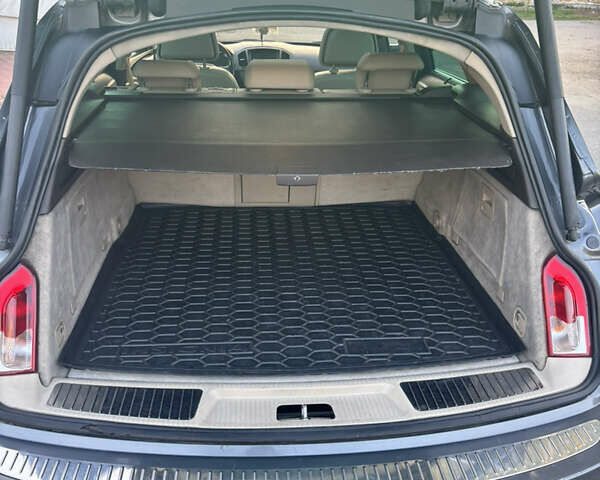 Серый Опель Инсигния, объемом двигателя 1.96 л и пробегом 320 тыс. км за 6999 $, фото 4 на Automoto.ua