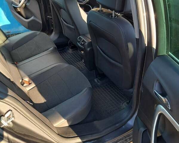 Серый Опель Инсигния, объемом двигателя 2 л и пробегом 150 тыс. км за 8700 $, фото 5 на Automoto.ua