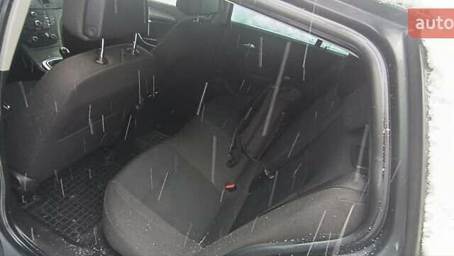 Серый Опель Инсигния, объемом двигателя 1.96 л и пробегом 299 тыс. км за 7500 $, фото 5 на Automoto.ua