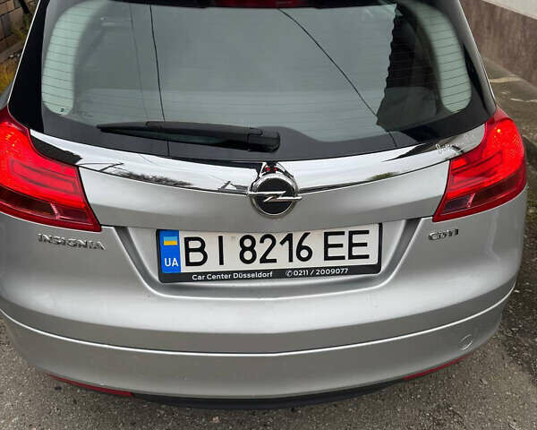 Серый Опель Инсигния, объемом двигателя 1.96 л и пробегом 234 тыс. км за 7700 $, фото 6 на Automoto.ua