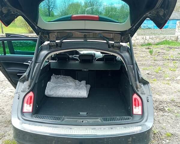 Серый Опель Инсигния, объемом двигателя 2 л и пробегом 240 тыс. км за 9500 $, фото 6 на Automoto.ua