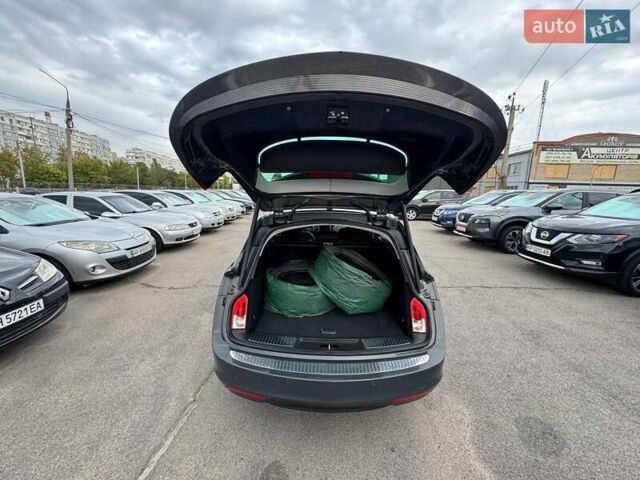 Сірий Опель Інсігнія, об'ємом двигуна 1.96 л та пробігом 245 тис. км за 8499 $, фото 5 на Automoto.ua