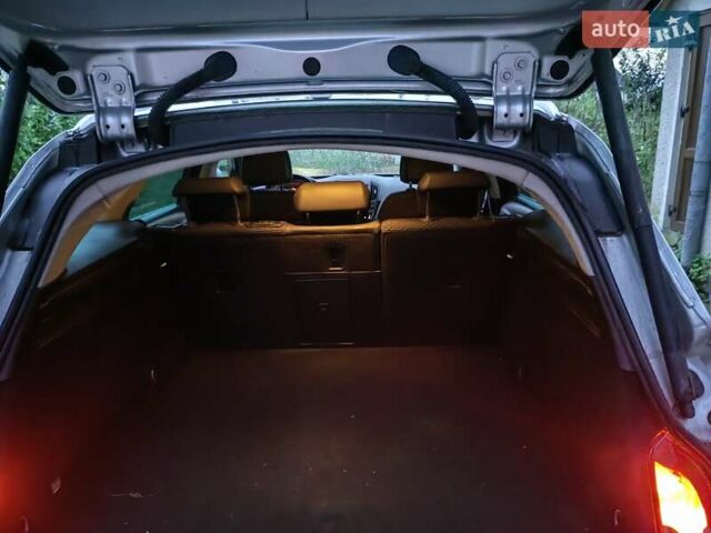 Сірий Опель Інсігнія, об'ємом двигуна 1.96 л та пробігом 239 тис. км за 10000 $, фото 6 на Automoto.ua