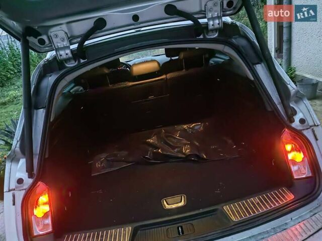 Серый Опель Инсигния, объемом двигателя 1.96 л и пробегом 239 тыс. км за 10000 $, фото 7 на Automoto.ua