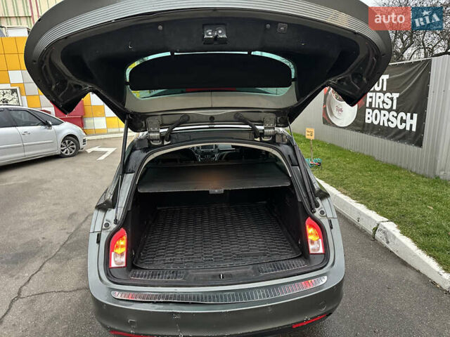 Сірий Опель Інсігнія, об'ємом двигуна 1.6 л та пробігом 252 тис. км за 9200 $, фото 6 на Automoto.ua