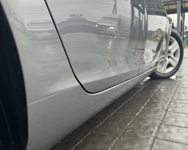 Сірий Опель Інсігнія, об'ємом двигуна 1.6 л та пробігом 258 тис. км за 10899 $, фото 7 на Automoto.ua