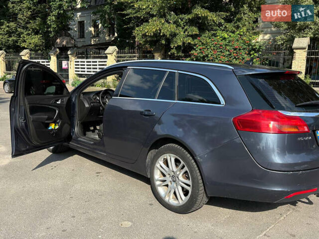 Синий Опель Инсигния, объемом двигателя 1.96 л и пробегом 312 тыс. км за 7500 $, фото 4 на Automoto.ua