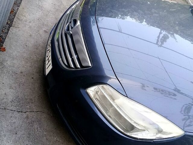 Синий Опель Инсигния, объемом двигателя 2 л и пробегом 230 тыс. км за 5500 $, фото 2 на Automoto.ua