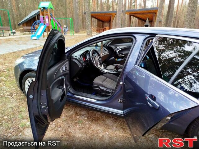 Синий Опель Инсигния, объемом двигателя 2 л и пробегом 303 тыс. км за 7700 $, фото 1 на Automoto.ua