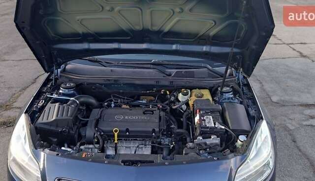 Синий Опель Инсигния, объемом двигателя 1.8 л и пробегом 208 тыс. км за 7300 $, фото 6 на Automoto.ua