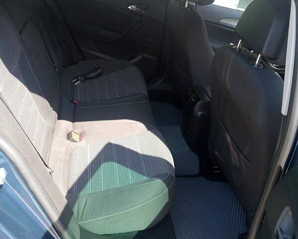 Синий Опель Инсигния, объемом двигателя 2 л и пробегом 240 тыс. км за 8350 $, фото 4 на Automoto.ua