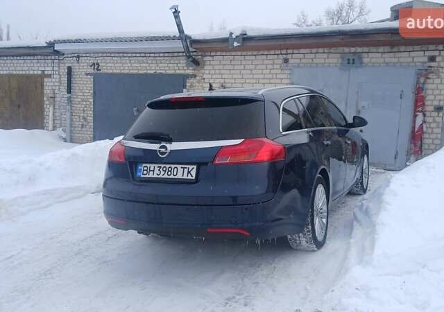 Синий Опель Инсигния, объемом двигателя 1.96 л и пробегом 320 тыс. км за 7600 $, фото 4 на Automoto.ua