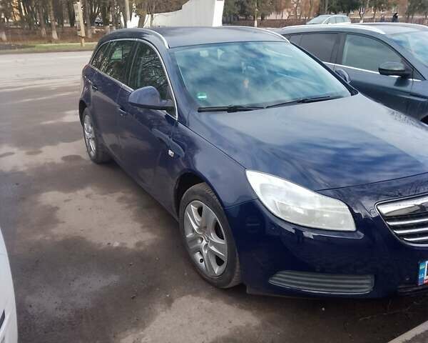 Синий Опель Инсигния, объемом двигателя 2 л и пробегом 249 тыс. км за 8600 $, фото 1 на Automoto.ua