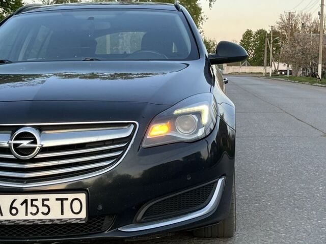 Синий Опель Инсигния, объемом двигателя 2 л и пробегом 319 тыс. км за 8500 $, фото 3 на Automoto.ua