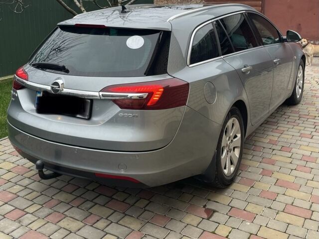 Синий Опель Инсигния, объемом двигателя 2 л и пробегом 247 тыс. км за 9500 $, фото 1 на Automoto.ua