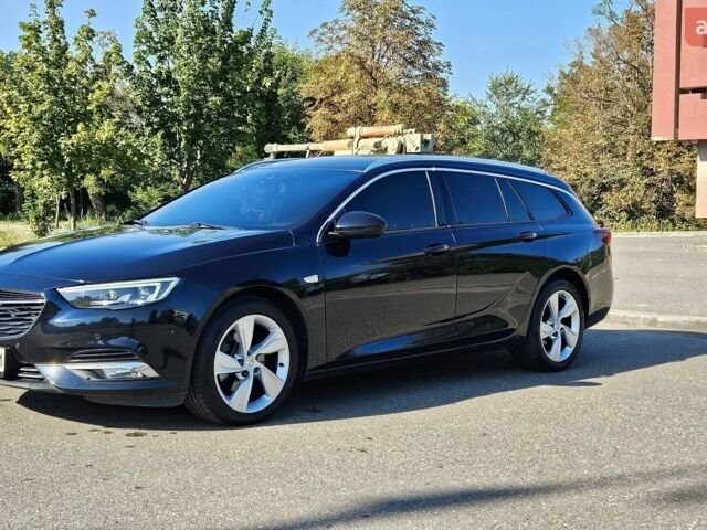Синий Опель Инсигния, объемом двигателя 2 л и пробегом 135 тыс. км за 16000 $, фото 1 на Automoto.ua