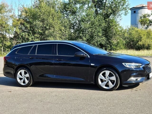Синий Опель Инсигния, объемом двигателя 2 л и пробегом 135 тыс. км за 16000 $, фото 2 на Automoto.ua