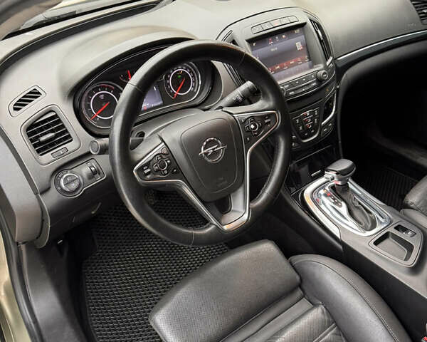 Зеленый Опель Инсигния, объемом двигателя 2 л и пробегом 130 тыс. км за 10800 $, фото 5 на Automoto.ua