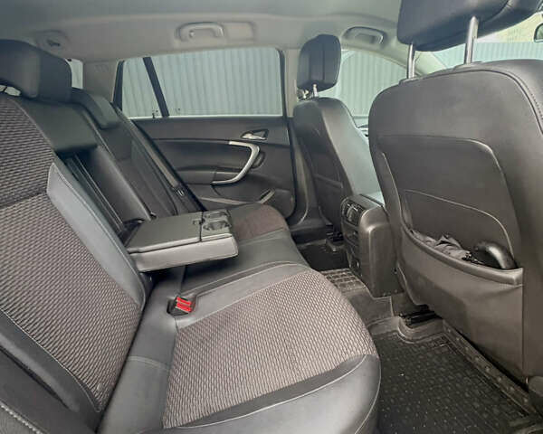 Зелений Опель Інсігнія, об'ємом двигуна 1.96 л та пробігом 178 тис. км за 10400 $, фото 24 на Automoto.ua