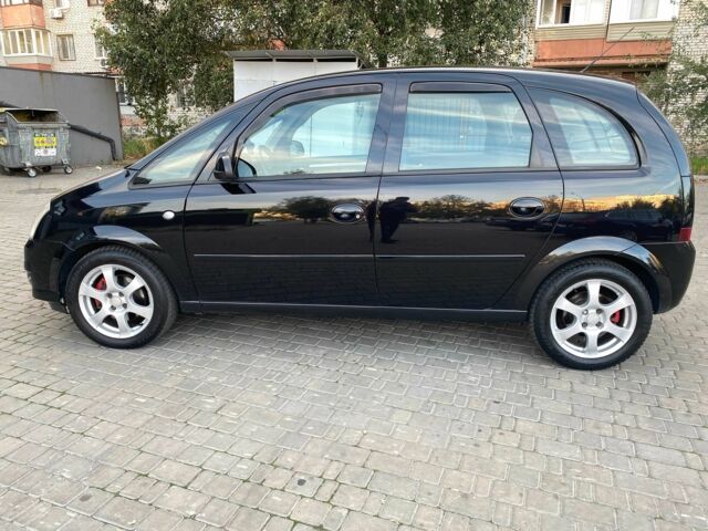 Черный Опель Мерива, объемом двигателя 1.8 л и пробегом 260 тыс. км за 5800 $, фото 2 на Automoto.ua