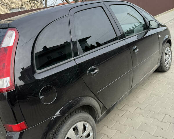 Черный Опель Мерива, объемом двигателя 1.6 л и пробегом 157 тыс. км за 3600 $, фото 1 на Automoto.ua