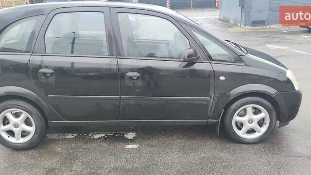 Черный Опель Мерива, объемом двигателя 1.6 л и пробегом 240 тыс. км за 3550 $, фото 4 на Automoto.ua