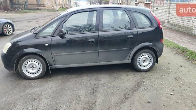 Черный Опель Мерива, объемом двигателя 1.6 л и пробегом 240 тыс. км за 3550 $, фото 5 на Automoto.ua