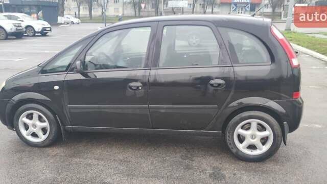 Черный Опель Мерива, объемом двигателя 1.6 л и пробегом 240 тыс. км за 3550 $, фото 1 на Automoto.ua