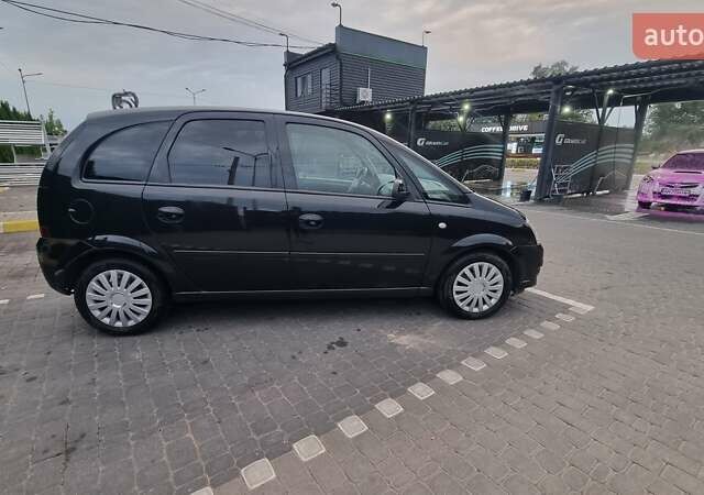 Черный Опель Мерива, объемом двигателя 1.6 л и пробегом 212 тыс. км за 4900 $, фото 7 на Automoto.ua