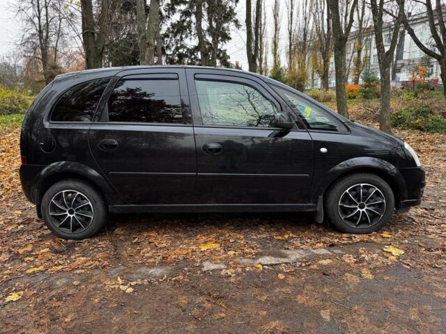 Черный Опель Мерива, объемом двигателя 1.6 л и пробегом 262 тыс. км за 4740 $, фото 6 на Automoto.ua