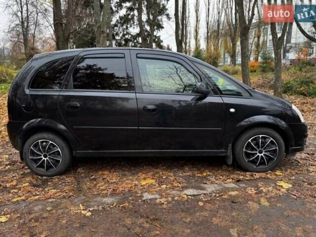 Черный Опель Мерива, объемом двигателя 1.6 л и пробегом 262 тыс. км за 4100 $, фото 4 на Automoto.ua