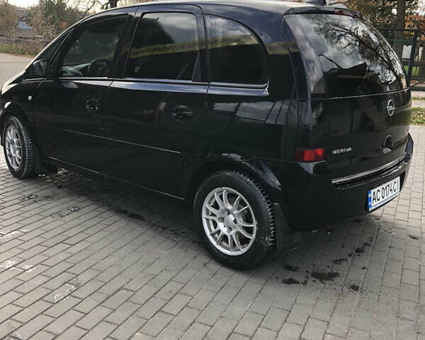 Черный Опель Мерива, объемом двигателя 1.25 л и пробегом 197 тыс. км за 3650 $, фото 7 на Automoto.ua