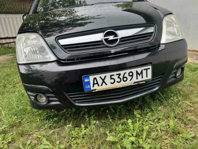 Черный Опель Мерива, объемом двигателя 1.6 л и пробегом 147 тыс. км за 4950 $, фото 1 на Automoto.ua