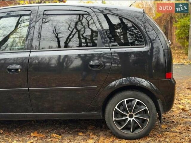 Черный Опель Мерива, объемом двигателя 1.6 л и пробегом 262 тыс. км за 4100 $, фото 6 на Automoto.ua